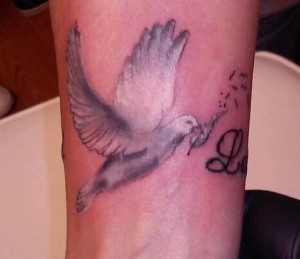 Dove tattoo on wrist